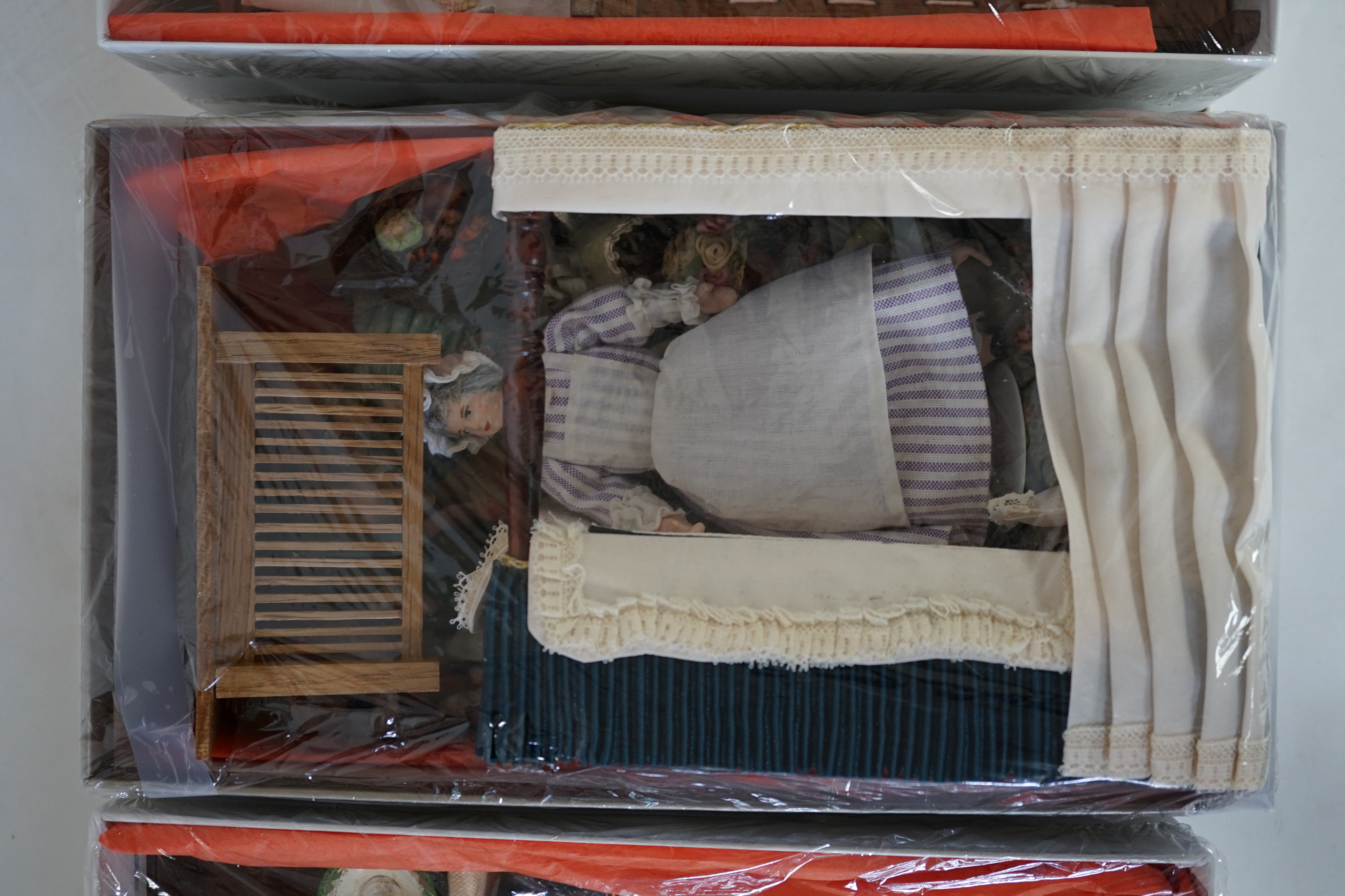 A large modern Georgian style dolls house and extensive contents, with eight fully decorated rooms on four floors, and fitted with electric lighting, removable front steps and pavement section to access basement rooms, 1